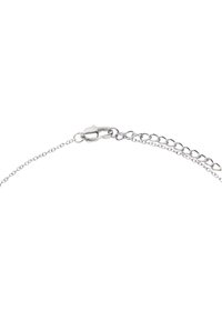 Srebrna bransoleta łańcuszkowa z zapięciem typu lobster, wydłużonymi ogniwami oraz regulowanym przedłużeniem z małymi okrągłymi akcentami.