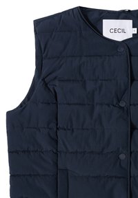 Gilet imbottito blu navy con texture trapuntata, scollo rotondo e bottoni frontali. Etichetta del brand "CECIL" all'interno. Senza maniche.