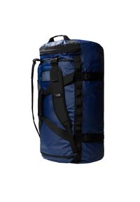 Borsa da viaggio blu navy con cinturini neri, maniglia superiore e tasca in rete. Realizzata in materiale resistente e impermeabile. Forma cilindrica grande.