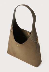 Olive green suede handbag with a curved handle, gold accent hardware, and a single interior pocket. Smooth texture with clean lines.
