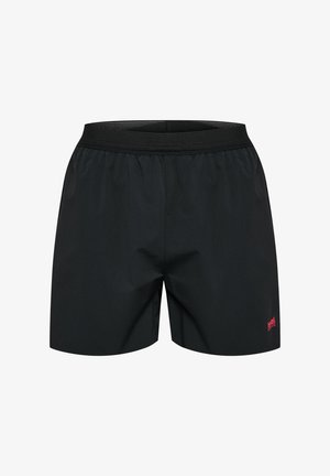 Shorts de sport noirs avec une texture lisse, une taille élastique et un petit logo rouge sur le bas du côté droit.