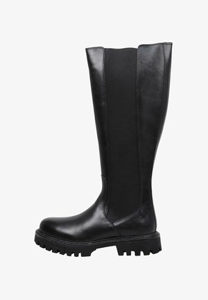 Bottines noires montantes avec un devant en cuir lisse et un panneau en tissu élastiqué à l'arrière. Présente une semelle épaisse avec une texture striée.