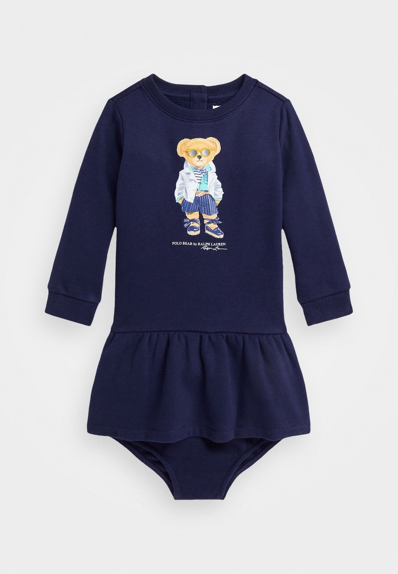 Robe pour bébé à manches longues bleu marine avec une jupe froncée et une illustration d'un ours portant des lunettes de soleil, une veste et un short sur le devant.