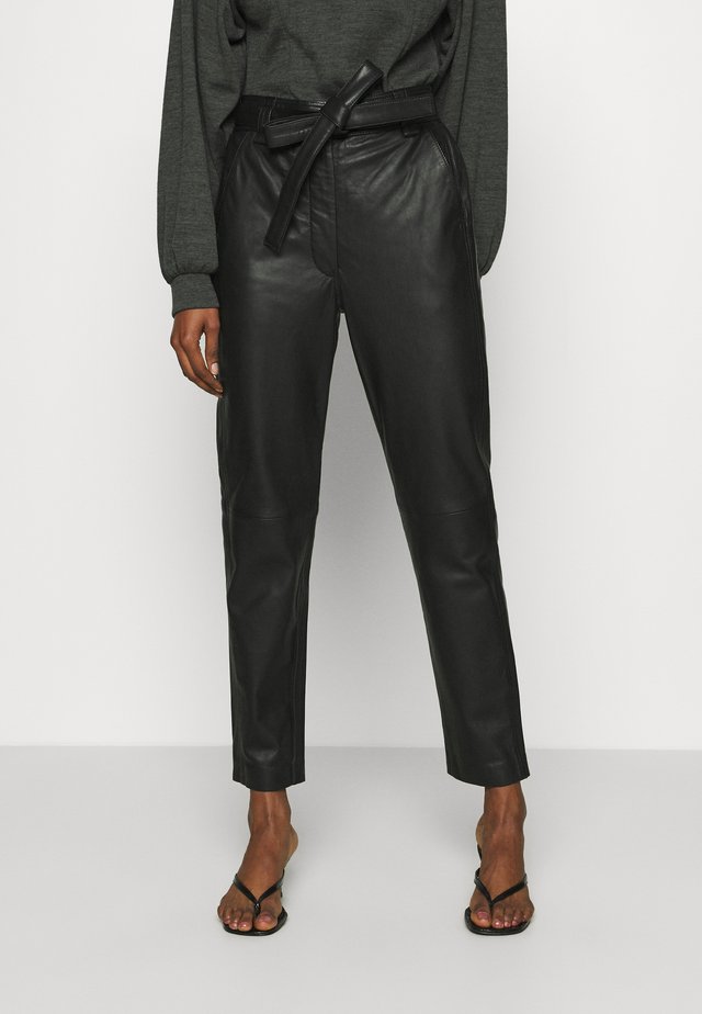 INDIE TROUSERS - Leather trousers - caviar