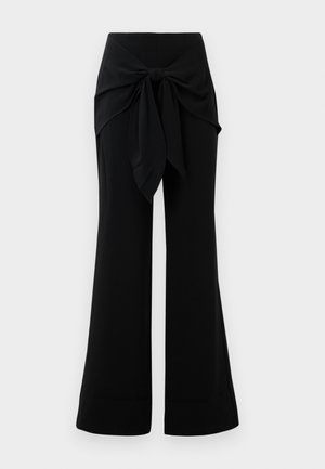 Black wide-leg pants with a waist tie detail. Made from soft fabric, featuring a smooth texture and clean lines. Hem slightly flared.