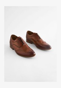 Sélectionné, tan brown