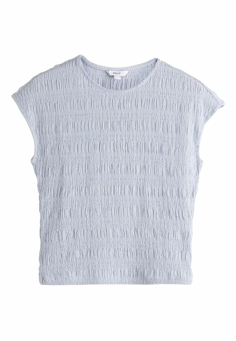 Blouse bleu clair à manches courtes texturée avec un motif de tissu froncé et un col rond, étiquette "NEXT" à l'intérieur du col.