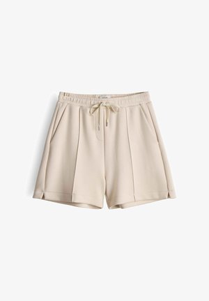 Beige Shorts aus weichem Stoff, mit elastischem Bund, Kordelzug mit Metallenden und Seitentaschen. Vorderseite mit Bügelfalten.