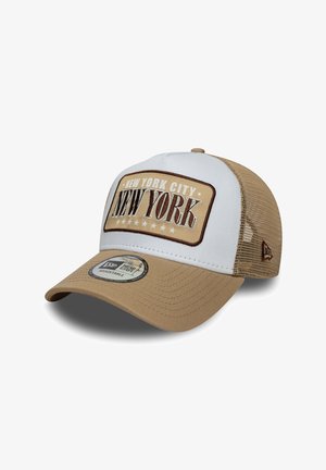 Beige and white baseball cap with mesh sides, featuring an embroidered "New York City" logo on the front and an adjustable strap.