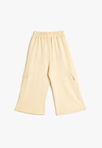 Ljust gula, vida byxor med mjuk textur, utrustade med elastisk midja och två sidofickor i cargo-stil.