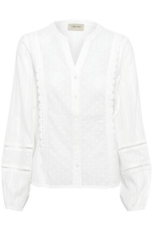 Blusa blanca de botones con detalles de brodería inglesa, un cuello con solapa y mangas abullonadas con puños elásticos. Textura de tela suave.