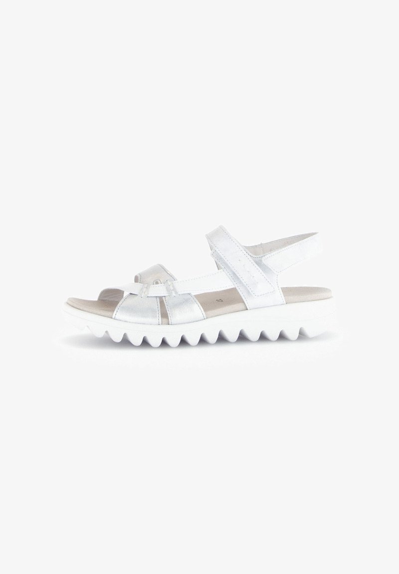 Zilveren leren sandalen met een gelaagde witte zool, verstelbare riempjes en een textuur in de binnenzool. Ontworpen voor comfort en ondersteuning.