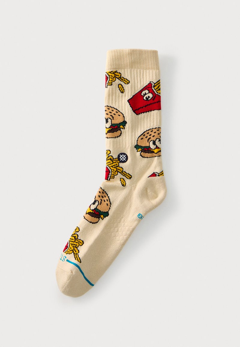 Chaussette beige avec des images de dessins animés de hamburgers et des contenants rouges de frites avec des frites jaunes éparpillées autour.