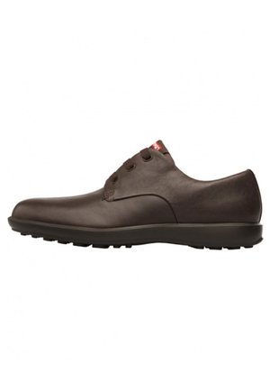 Brown leather shoe with a rounded toe, five lace-up eyelets, and a textured rubber sole for traction. Smooth surface with minimal detailing.