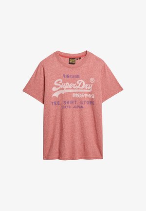 T-shirt en coton rouge chiné avec le logo "SuperDry" en blanc et violet, col crew, manches courtes et coupe décontractée.
