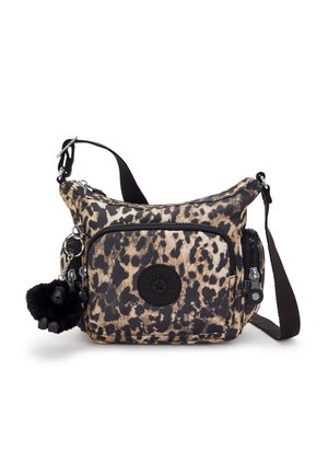 Animal print crossbody bag in beige and black fabric with adjustable strap, zippered compartments, and a furry keychain accent.