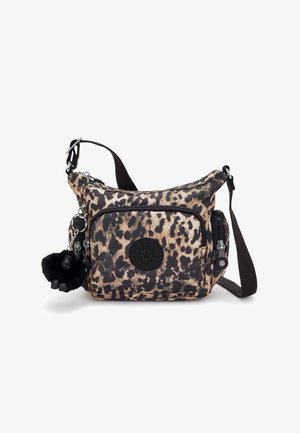 Animal print crossbody bag in beige and black fabric with adjustable strap, zippered compartments, and a furry keychain accent.