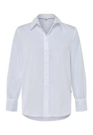 Camicia bianca a maniche lunghe in cotone. Presenta una chiusura frontale con bottoni, colletto classico e polsini arricciati. Texture liscia con un taglio dritto.