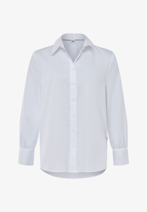 Camisa blanca de manga larga hecha de algodón. Cuenta con un cierre de botones en la parte delantera, cuello clásico y puños fruncidos. Textura suave con un corte recto.