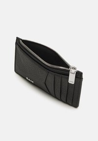 Black leather wallet with a textured finish, zippered closure, and silver hardware. Includes card slots and debossed logo detail.
