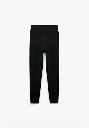 Czarne legginsy o wysokim stanie, pełnej długości, z płaskimi szwami, zaprojektowane z myślą o ścisłym, komfortowym dopasowaniu.