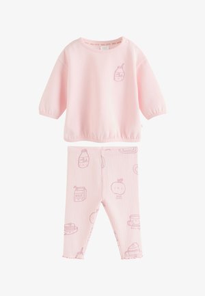 Haut à manches longues rose clair et leggings côtelés assortis avec des illustrations de bouteilles de lait souriantes, de fruits et de nourriture pour le petit-déjeuner.