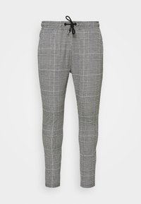 Calças cinza xadrez com cintura elástica e cordão. Design ajustado, apresentando um tecido texturizado e um padrão de grelha clássico.