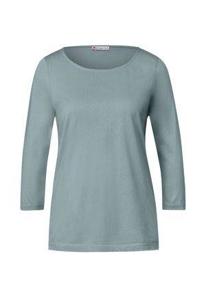 Light blue, long-sleeve top with a round neckline. Made of soft fabric, featuring a smooth texture and a straight cut design. Simple and versatile.