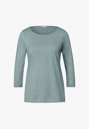 Vaaleansininen pitkähihainen paita, jossa on pyöreä kaula-aukko. Valmistettu pehmeästä kankaasta, jossa on sileä pinta ja suora leikkaus. Yksinkertainen ja monikäyttöinen.