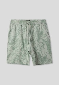 Pantaloni corto verde chiaro in morbido tessuto, con un motivo a foglia tropicale, vita elastica e tasche laterali.