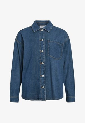 Tumedat sinised teksasabaga särk, millel on nööbid esiküljel, klassikaline krae, üks rinna-tasku ja pikad varrukad nööpidega mansettidega.