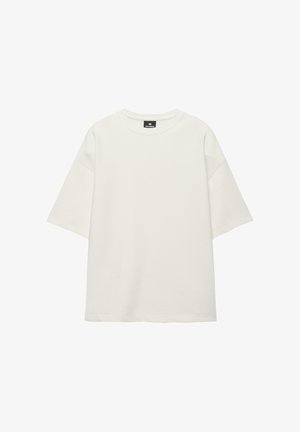 Bela čezmerno velika majica s kratkimi rokavi in okroglim izrezom, enostavnega dizajna z rahlo spuščenimi ramenskimi šivi.