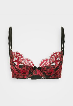 Juodas ir raudonas nėriniuotas liemenėlė su viela, puošta gėlių raštu, reguliuojamos juodos petnešėlės ir mažas juodas kaspinėlis priekyje, užsegimo vietoje.