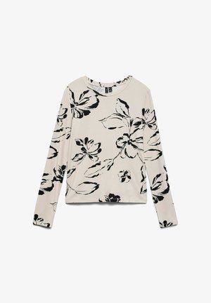 Camiseta de manga larga en algodón beige claro con estampado de flores negras. Presenta un escote redondo y un corte relajado. Textura suave, con detalles mínimos.