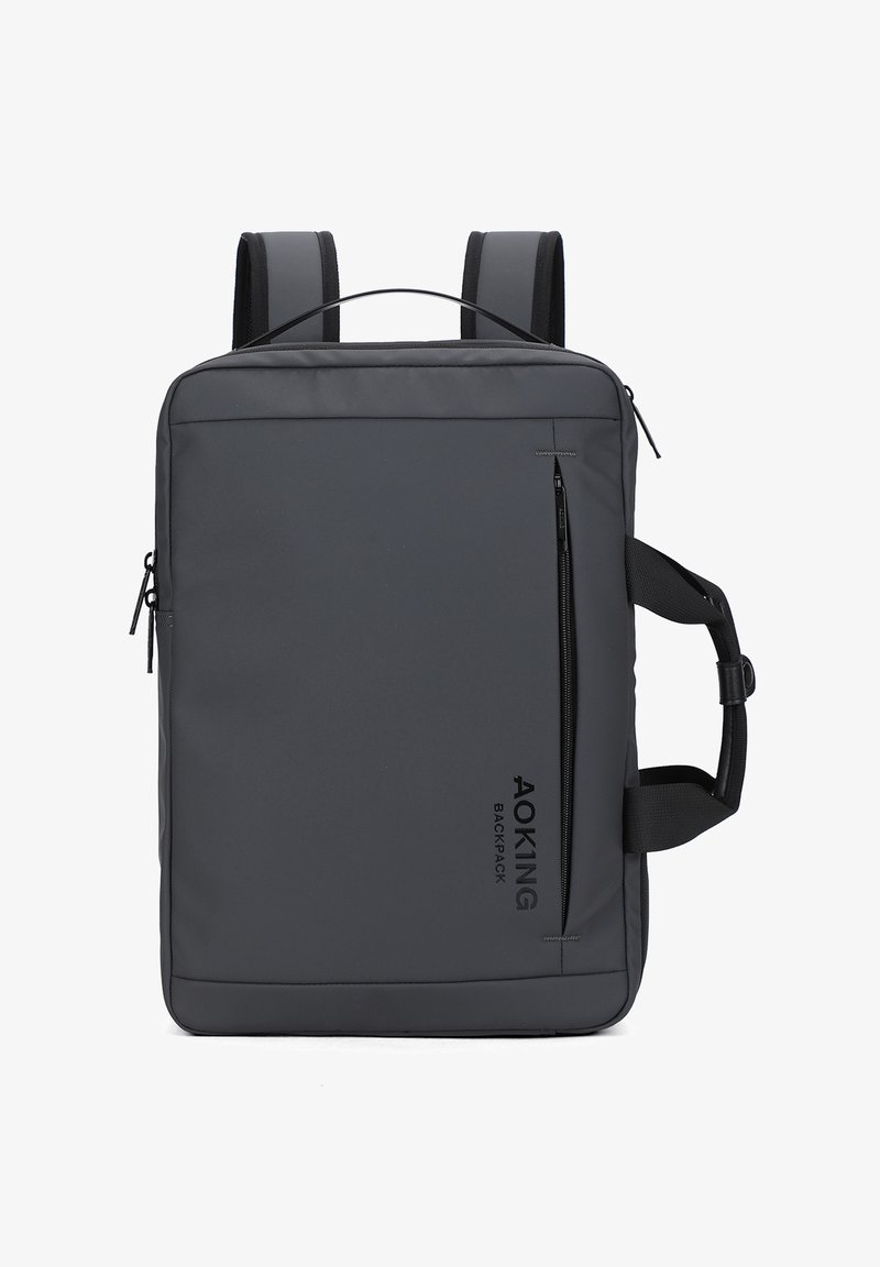 Sac à dos rectangulaire gris foncé avec fermeture éclair verticale à l'avant, bretelles rembourrées, poignée latérale et logo "AOKING BACKPACK" sur le devant.