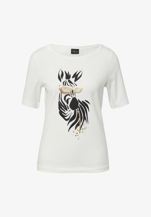 Biała bawełniana koszulka z czarno-złotym wzorem zebry w okularach przeciwsłonecznych. Okrągły dekolt i krótkie rękawy.