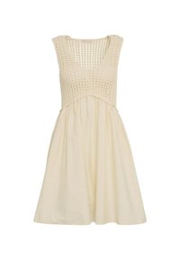 Vestido sin mangas en color crema con un cuerpo de ganchillo y una falda fluida, con un top texturizado y una tela suave en la parte inferior.