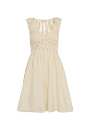Abito senza maniche color crema con corpetto all'uncinetto e gonna fluida, con una parte superiore testurizzata e una parte inferiore in tessuto liscio.