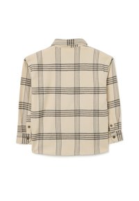 Beige geblokte flanellen shirt met een zwart geruit patroon. Lange mouwen met knoopmanchetten en een klassieke kraag. Zachte textuur.