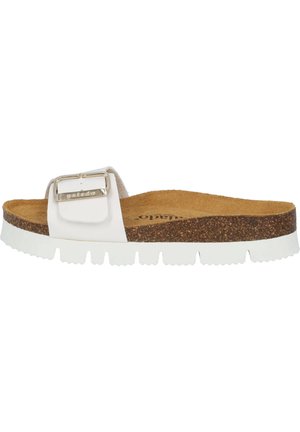 White slide sandal with a textured cork footbed, a thick white rubber sole, and a wide strap featuring a metal buckle detail.