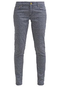 Pantalones ajustados azul marino con un patrón floral en blanco, cinco bolsillos y acentos en dorado. Fabricados con un tejido elástico para mayor comodidad.
