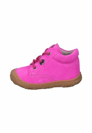 Pink suede children's shoes with thick rubber soles, round laces, and metal eyelets. Rounded toe and cushioned ankle for support.