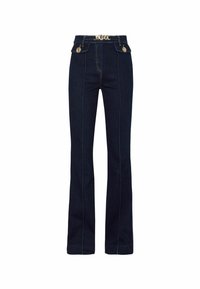 Tmavě modré zvonové džínsy vyrobené z denimu, s vysokým pasem, zlatými kovovými doplňky a kontrastním prošíváním podél švů.