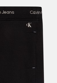 Calvin Klein Jeans INTARSIA - Verryttelyhousut - black
