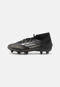adidas Performance F50 LEAGUE MID SG - Botas de fútbol para terrenos blandos - core black/iron metallic/gold metallic