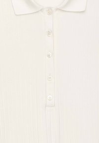 White ribbed fabric with five vertically aligned pearl buttons and a classic collar at the top center.