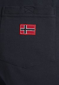 Jan Vanderstorm VEGAR - Tracksuit bottoms - dunkelblau