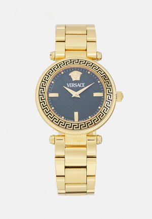 Orologio Versace dorato con quadrante nero, faccia a motivi intricati, emblemma Medusa e design a chiave greca sul bezel. Maglia in metallo.