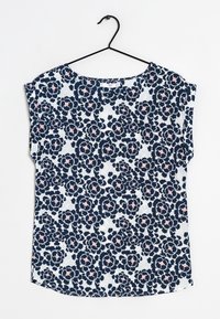 Blouse florale bleue marine à manches courtes, avec un col rond et un tissu léger. Le motif comprend des accents floraux roses et blancs.