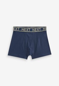 Sötétkék boxeralsó puha anyagból, arany színű márkázott elasztikus derékpánttal, amelyen a "NEXT" felirat ismétlődik.